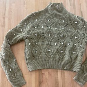 Green mock turtleneck with pearl details